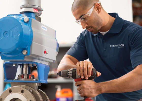A valve automation expert from Ferguson Industrial working on a project