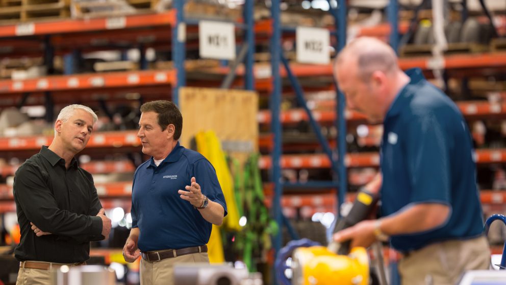 Ferguson Industrial experts in a warehouse sharing their expertise with a customer.