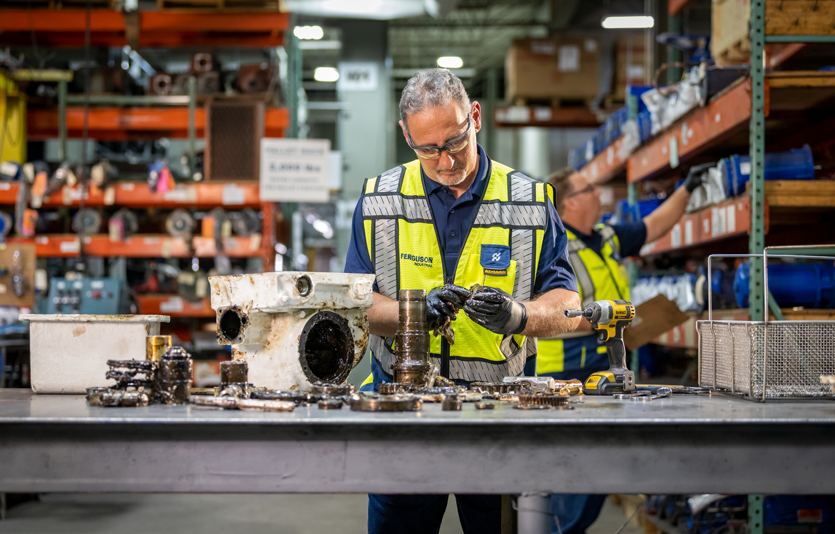 Ferguson Industrial flow control repair service expert repairing an industrial actuator.