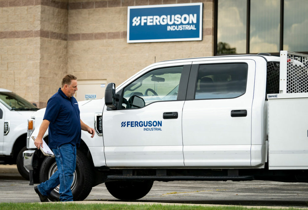 Ferguson associate heading to an industrial flow control plant to conduct an onsite survey.
