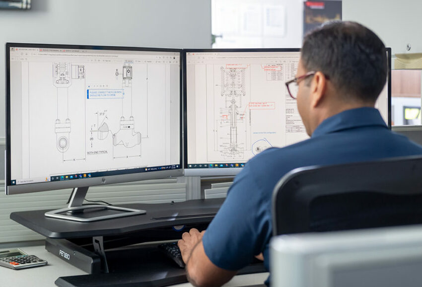 A flow control expert from Ferguson providing technical expertise by helping a customer design their valve assembly.