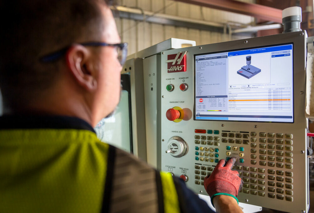 An engineer with technical expertise working on a valve assembly design for a flow control customer.