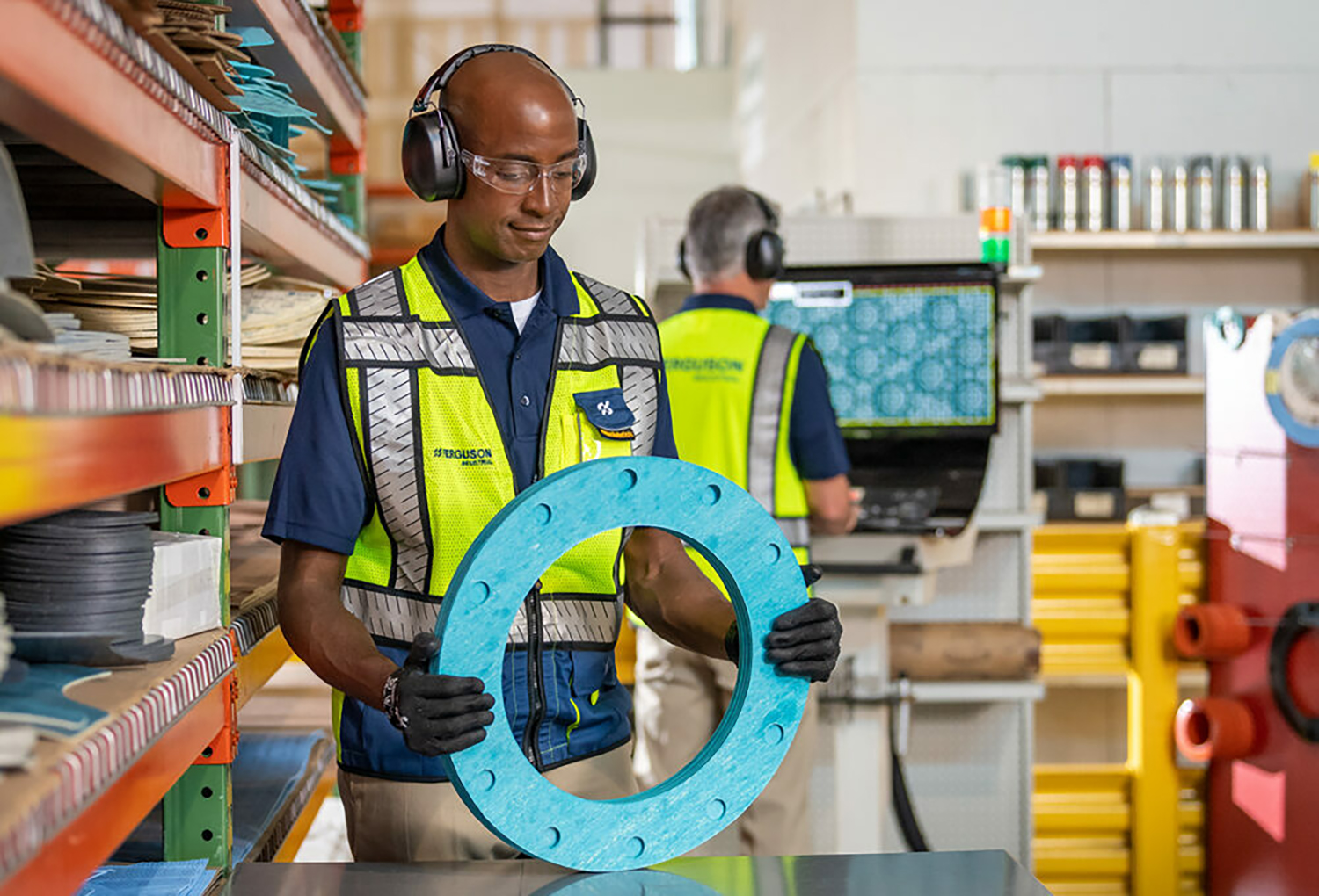 An associate analyzing inventory to enhance their spares management program.