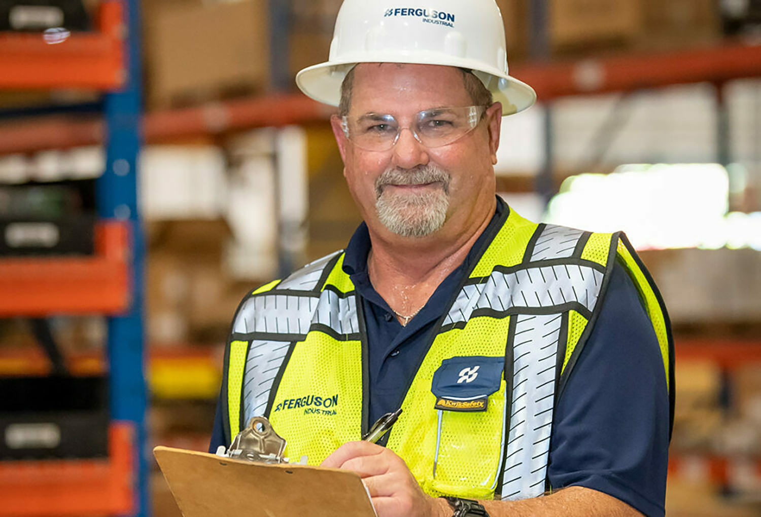 Ferguson associate visiting a customer's warehouse and offering inventory management recommendations.