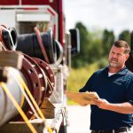 Ferguson Industrial associate inspecting an equipment delivery for an industrial manufacturer.